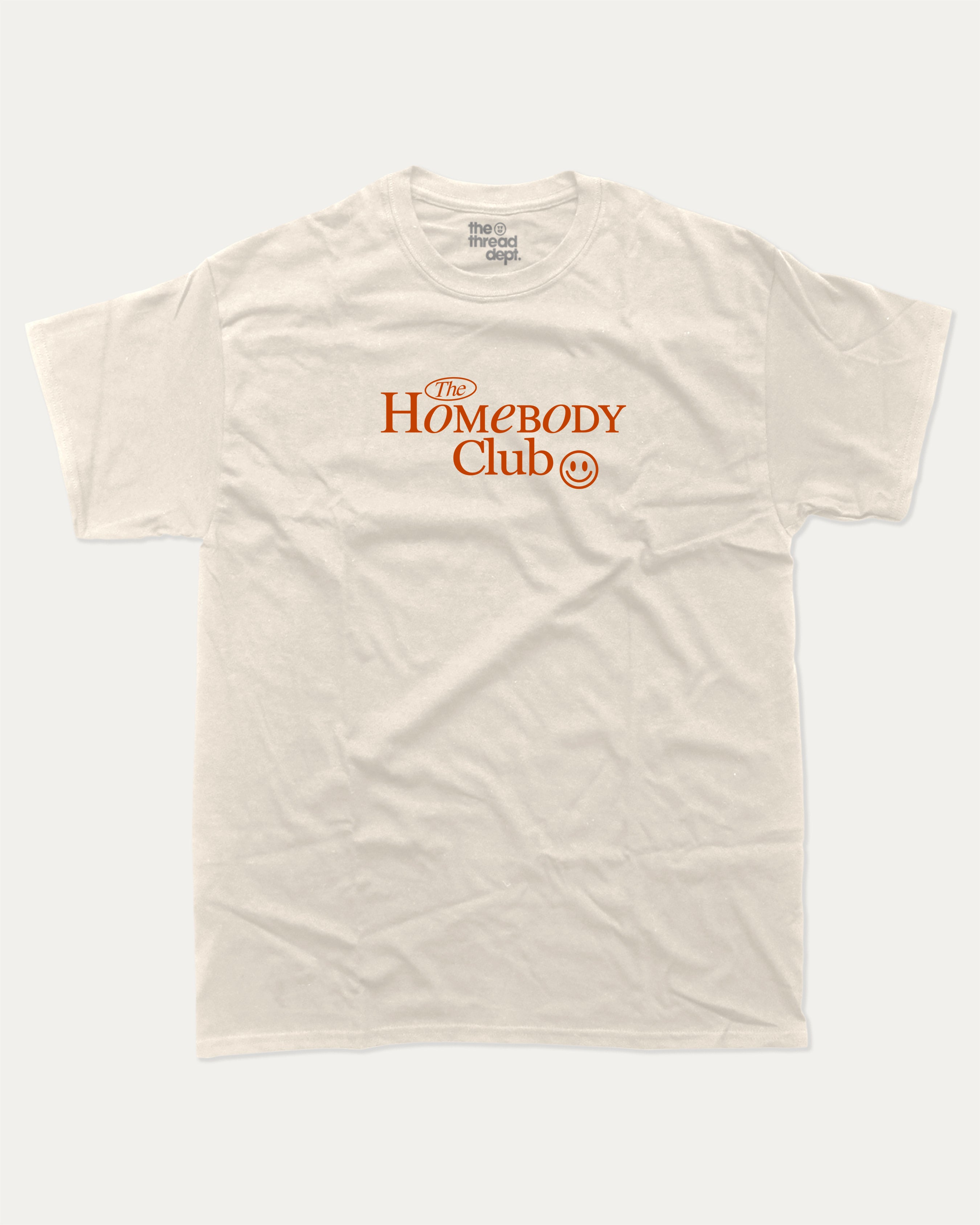The Homebody Club graphic tee with bold and humorous print, funny and trendy graphic. Vintage Inspired Graphic t shirt, Retro Inspired Graphic T shirt,  Perfect for adults and gift-giving. Cream shirt.