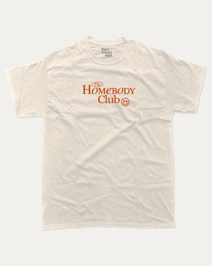 The Homebody Club graphic tee with bold and humorous print, funny and trendy graphic. Vintage Inspired Graphic t shirt, Retro Inspired Graphic T shirt,  Perfect for adults and gift-giving. Cream shirt.