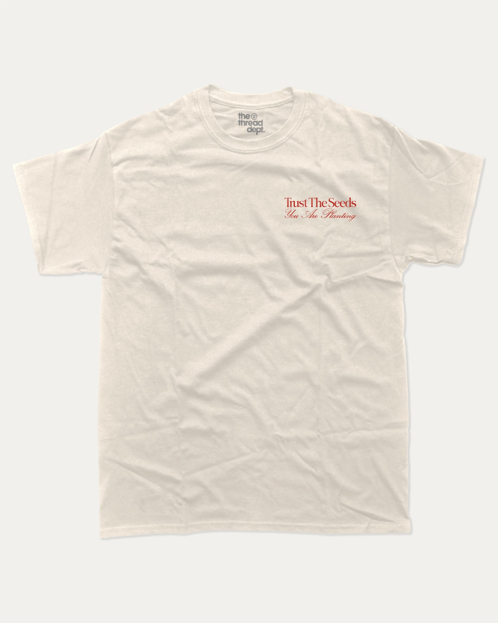 Trust The Seeds graphic t-shirt, Vintage Inspired Graphic T shirt, Retro Inspired Graphic T shirt, . A must-have funny tee, trending meme shirt, unique gift idea. Cream.