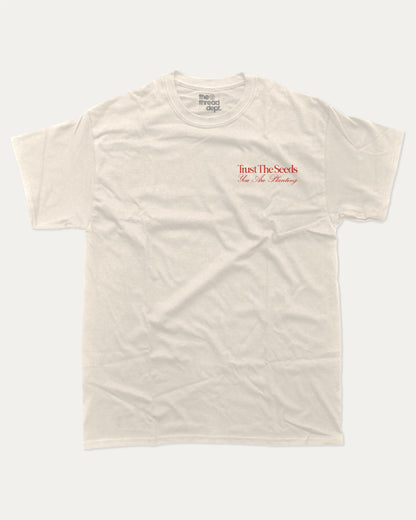 Trust The Seeds graphic t-shirt, Vintage Inspired Graphic T shirt, Retro Inspired Graphic T shirt, . A must-have funny tee, trending meme shirt, unique gift idea. Cream.