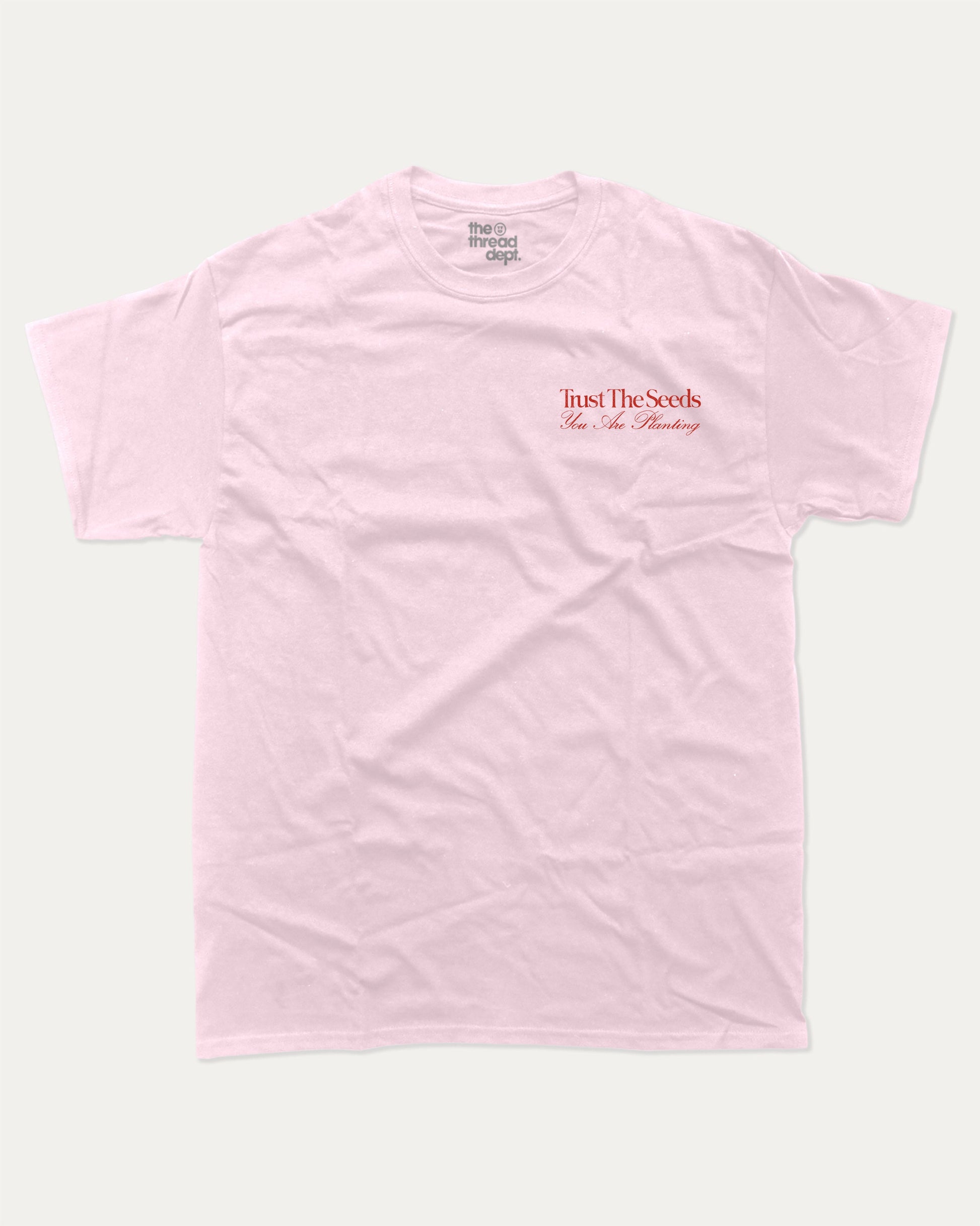 Trust The Seeds graphic t-shirt, Vintage Inspired Graphic T shirt, Retro Inspired Graphic T shirt, . A must-have funny tee, trending meme shirt, unique gift idea. Pink.