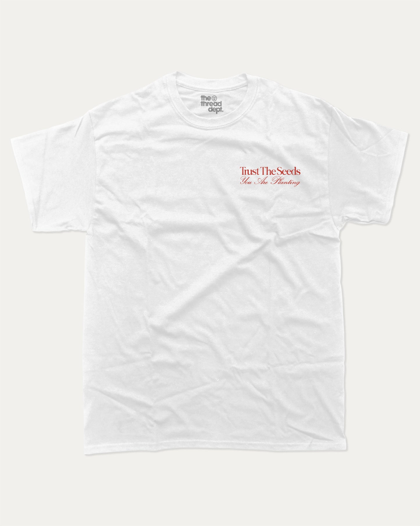 Trust The Seeds graphic t-shirt, Vintage Inspired Graphic T shirt, Retro Inspired Graphic T shirt, . A must-have funny tee, trending meme shirt, unique gift idea. White.