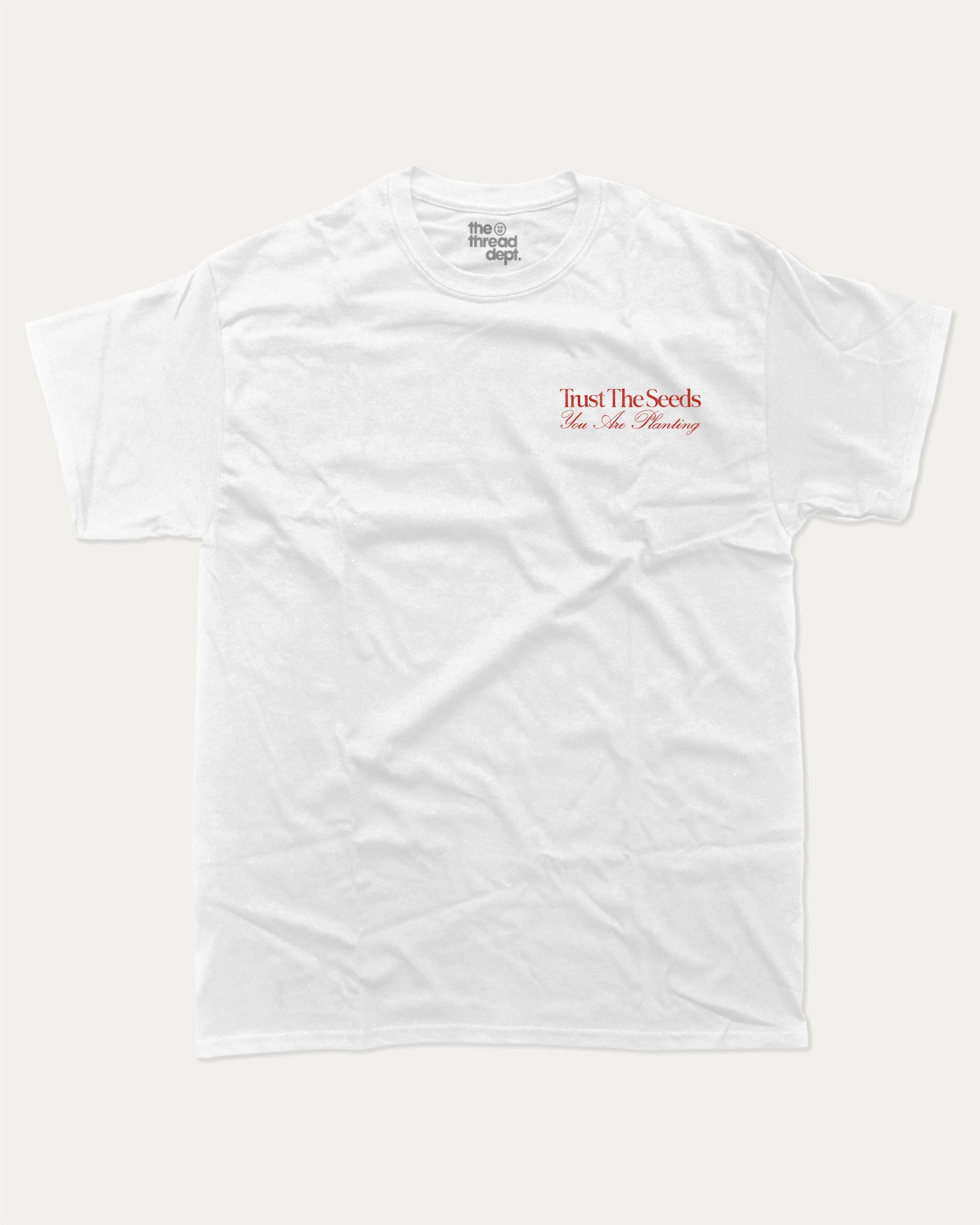 Trust The Seeds graphic t-shirt, Vintage Inspired Graphic T shirt, Retro Inspired Graphic T shirt, . A must-have funny tee, trending meme shirt, unique gift idea. White.