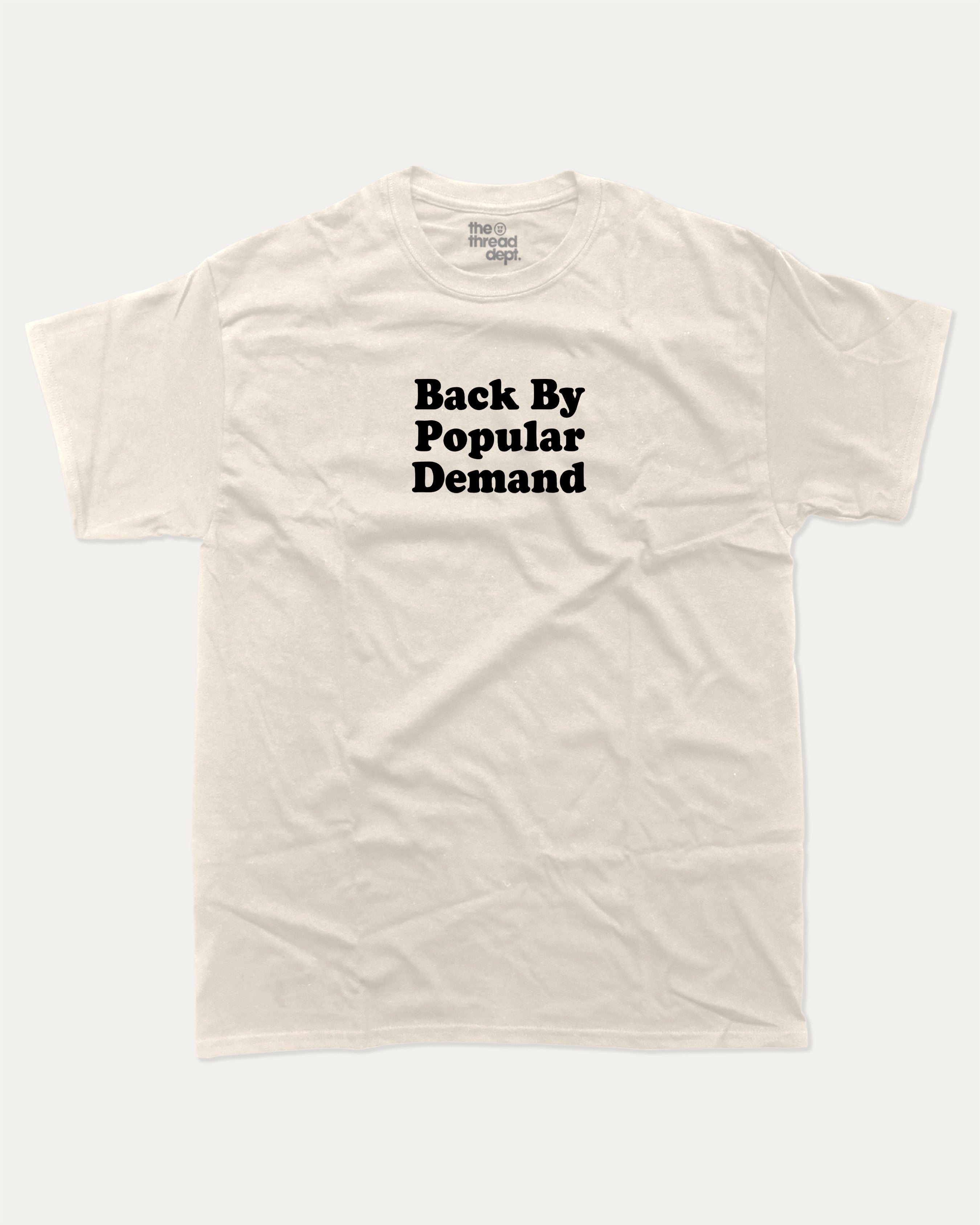 Back By Popular Demand graphic t-shirt, perfect for adults. A must-have funny back to school tee, trending meme shirt, unique gift idea. Cream.