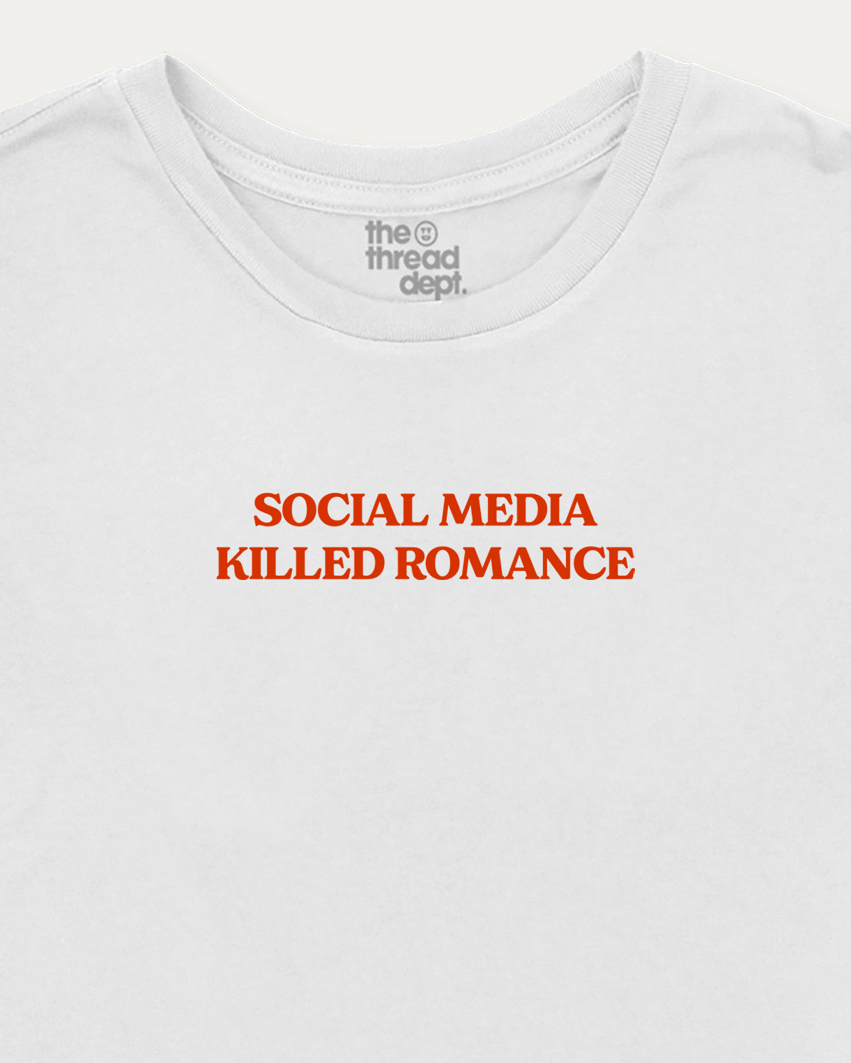White t-shirt with red text 'SOCIAL MEDIA KILLED ROMANCE' and brand logo on a white background