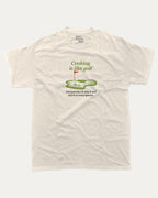 Cooking is like golf graphic tee with bold and humorous print, funny and trendy graphic. Perfect Gift for Golfers, Golf Graphic T shirt, Perfect for adults and gift-giving. Cream shirt.