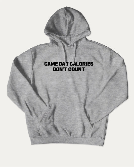 Game Day Calories Don't Count bold graphic hoodie. Bold sports tee, athletic style. A must-have graphic hoodie, cozy and cool, trending streetwear essential. Heather Grey hoodie