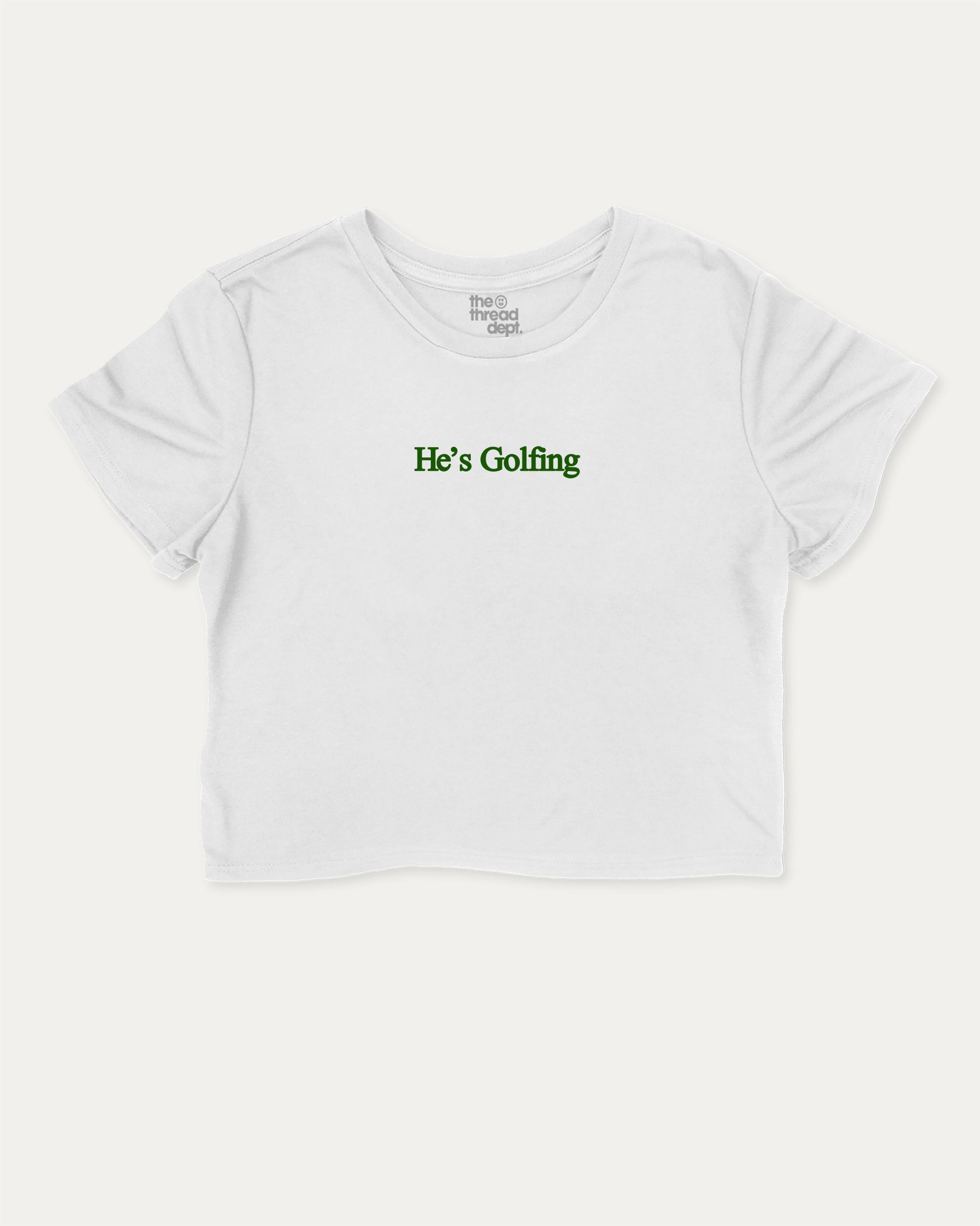 He's Golfing graphic crop tee with funny and trendy slogan print, perfect for women’s casual looks or layering. Perfect Gift for Golfers, Golf lovers Graphic cropped t shirt,   White crop t-shirt.