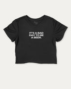 It's A Bad Day To Be A Beer graphic crop tee with funny and trendy sports print, perfect for women_ casual looks or layering. Black crop t-shirt.