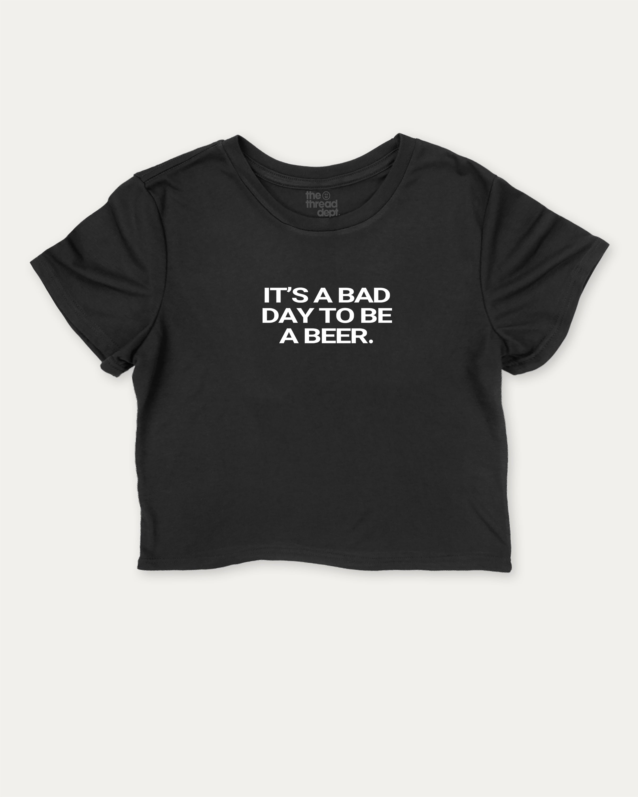 It's A Bad Day To Be A Beer graphic crop tee with funny and trendy sports print, perfect for women_ casual looks or layering. Black crop t-shirt.