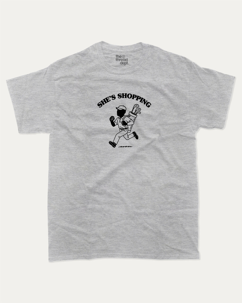 She's Shopping graphic tee with bold and humorous print, Golf Graphic T shirt, Perfect Gift for Golf Lover,  funny and trendy graphic. Perfect for adults and gift-giving. Heather Grey shirt.