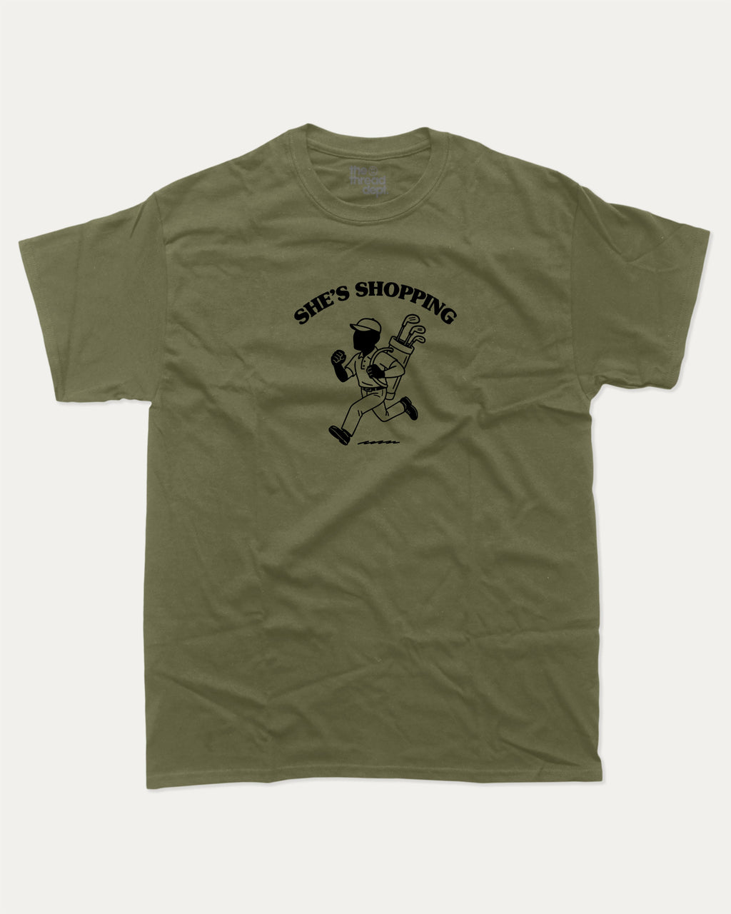 She's Shopping graphic tee with bold and humorous print, Golf Graphic T shirt, Perfect Gift for Golf Lover,  funny and trendy graphic. Perfect for adults and gift-giving. Military Green shirt.
