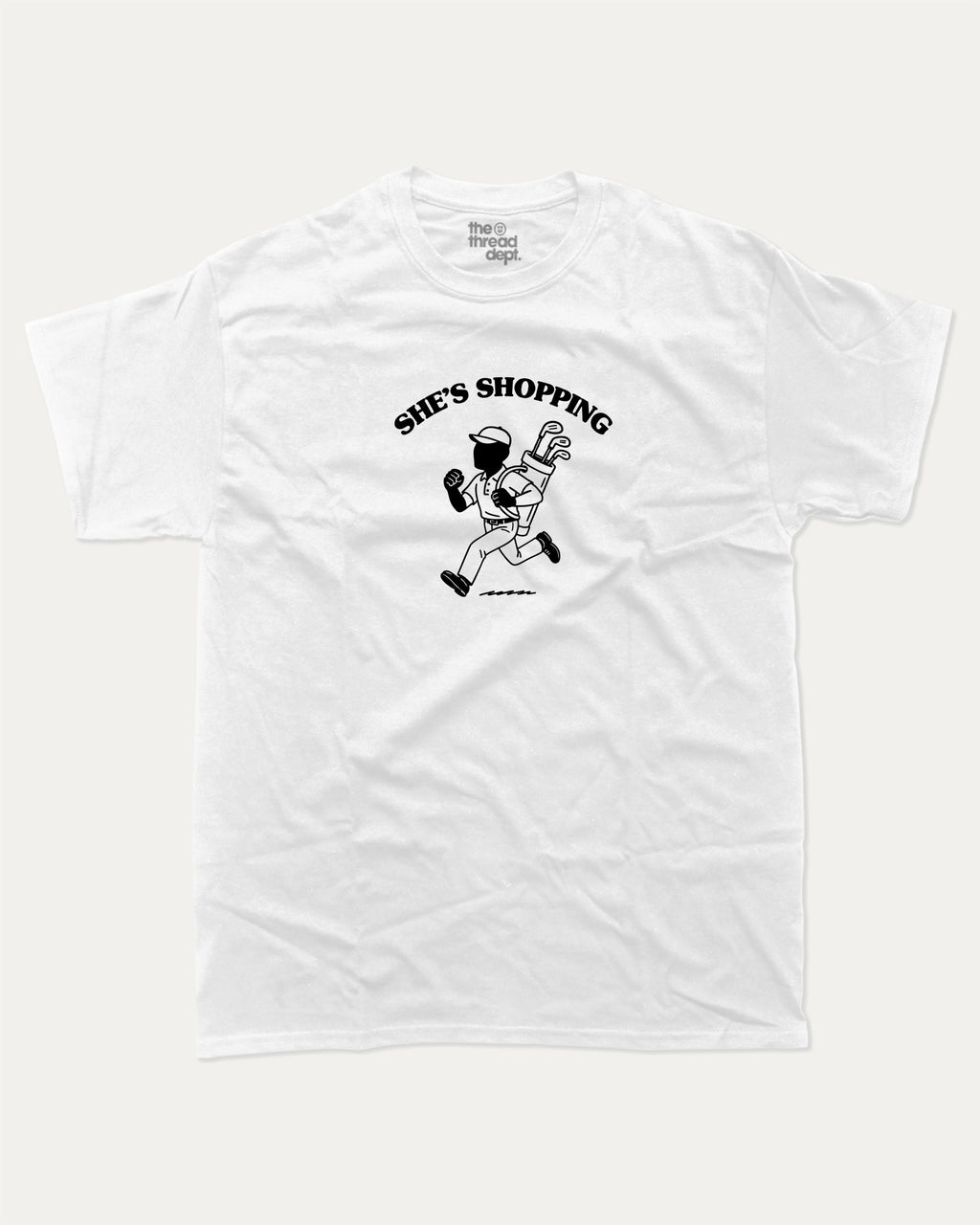 She's Shopping graphic tee with bold and humorous print, Golf Graphic T shirt, Perfect Gift for Golf Lover,  funny and trendy graphic. Perfect for adults and gift-giving. White shirt.