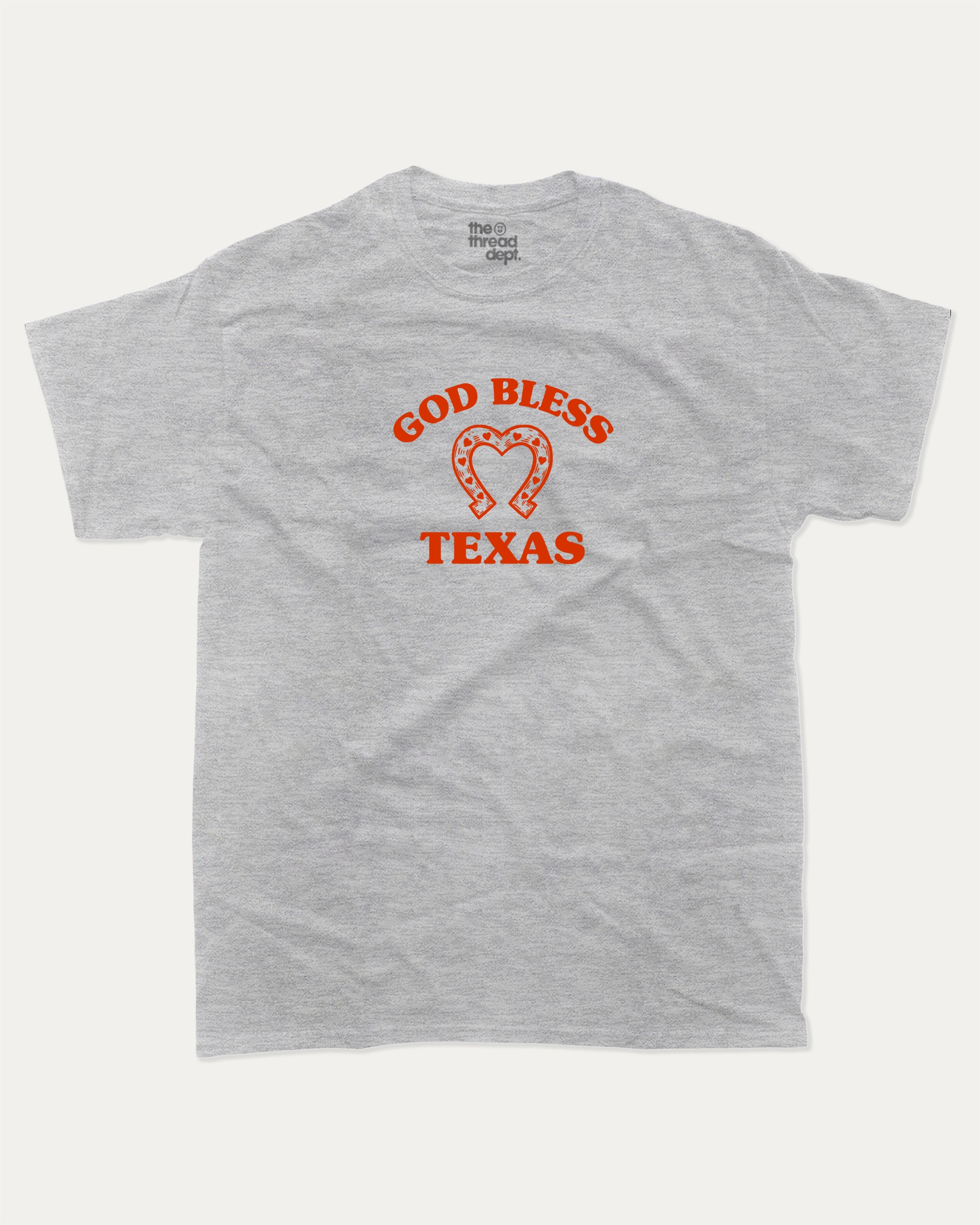 God Bless Taxas graphic tee with bold and humorous print, funny and trendy graphic. Perfect for adults and gift-giving. Heather Grey shirt.