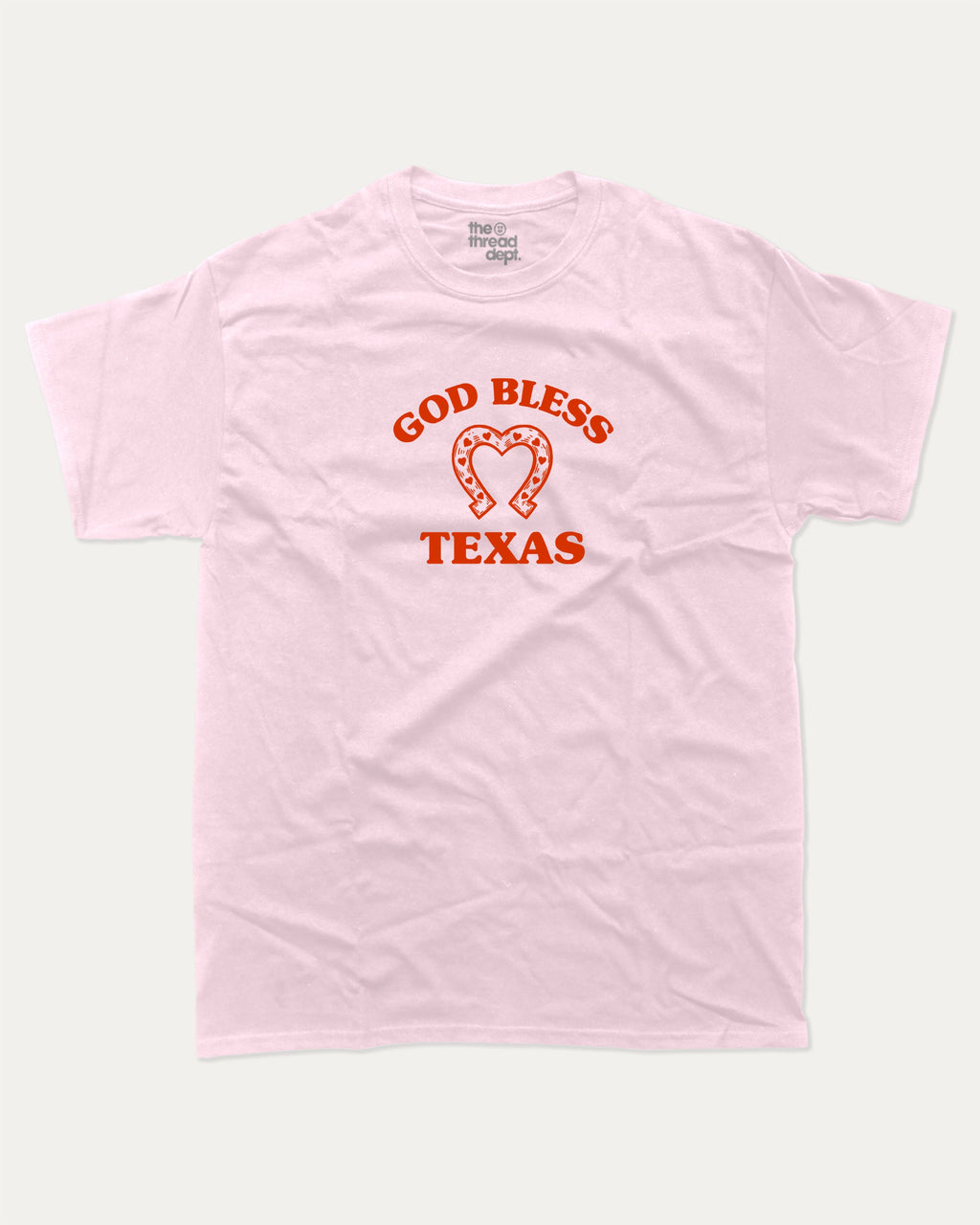 God Bless Taxas graphic tee with bold and humorous print, funny and trendy graphic. Perfect for adults and gift-giving. Pink shirt.