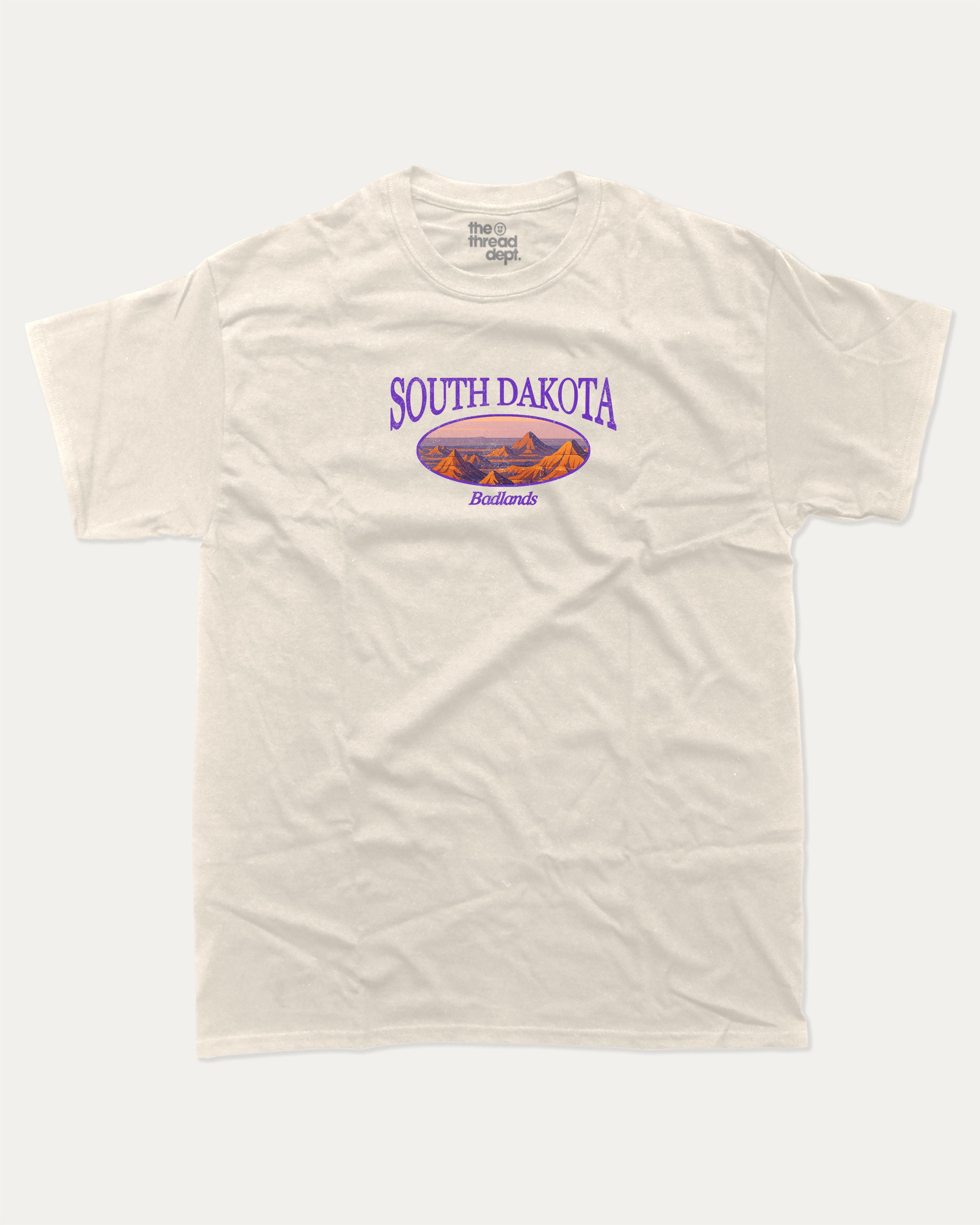 South Dakota graphic tee with bold and humorous print, State Graphic Tee, South Dakota State Graphic Tee,  funny and trendy graphic. Perfect for adults and gift-giving. Cream shirt.