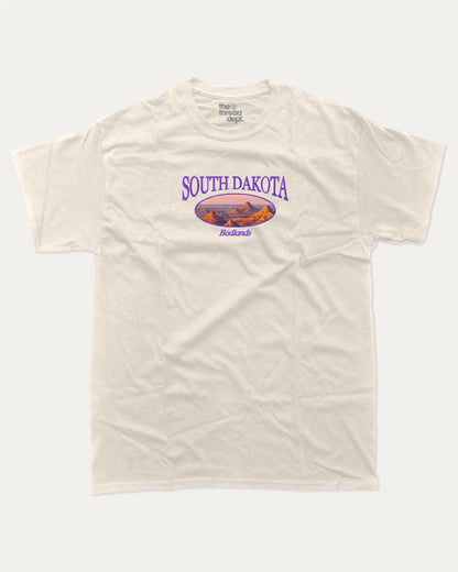 South Dakota graphic tee with bold and humorous print, State Graphic Tee, South Dakota State Graphic Tee,  funny and trendy graphic. Perfect for adults and gift-giving. Cream shirt.