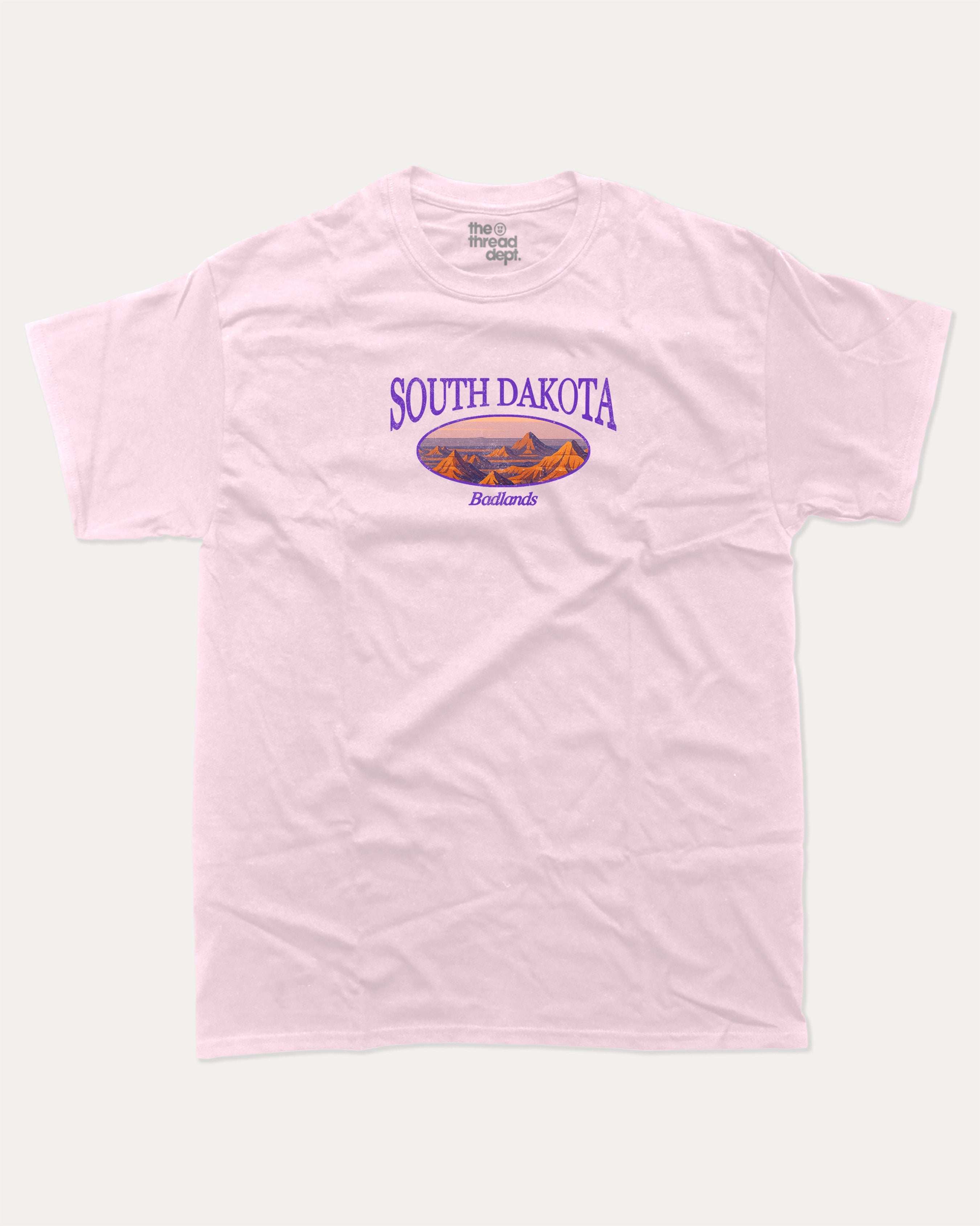 South Dakota graphic tee with bold and humorous print, State Graphic Tee, South Dakota State Graphic Tee,  funny and trendy graphic. Perfect for adults and gift-giving. Pink shirt.