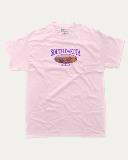South Dakota graphic tee with bold and humorous print, State Graphic Tee, South Dakota State Graphic Tee,  funny and trendy graphic. Perfect for adults and gift-giving. Pink shirt.