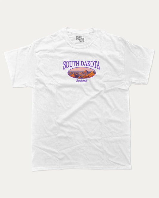 South Dakota graphic tee with bold and humorous print, State Graphic Tee, South Dakota State Graphic Tee,  funny and trendy graphic. Perfect for adults and gift-giving. White shirt.