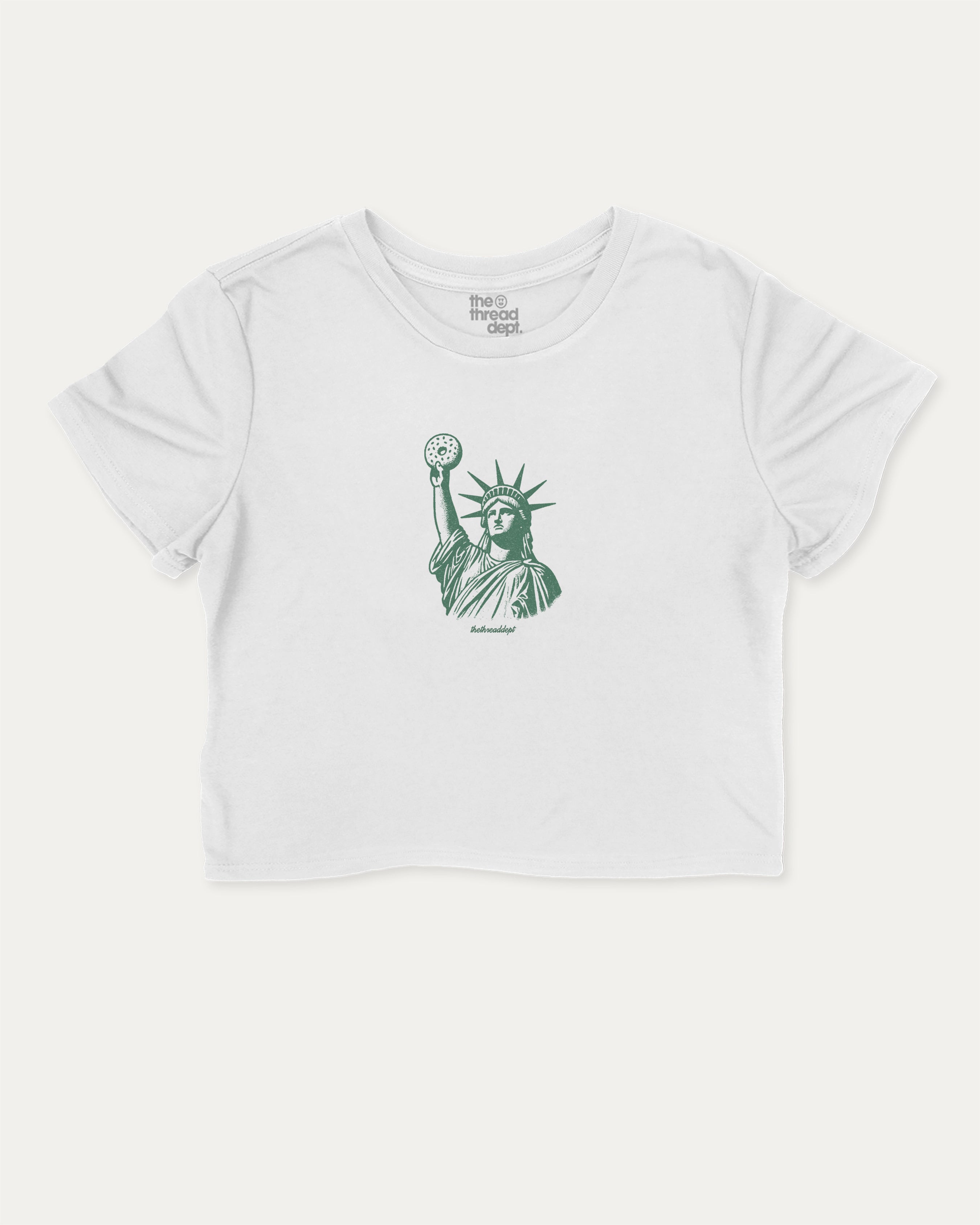 Statue of Liberty Bagle graphic crop tee with bagle and new york city print, perfect for women_ casual looks or layering. White crop t-shirt.