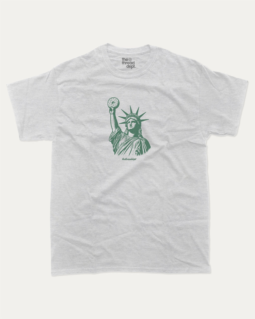 Statue of Liberty Bagle graphic tee with bold and humorous print, funny new york city graphic. Perfect for adults and gift-giving. Ash Grey shirt.