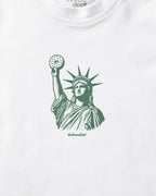 White t-shirt with green Statue of Liberty Bagle graphic on a white background