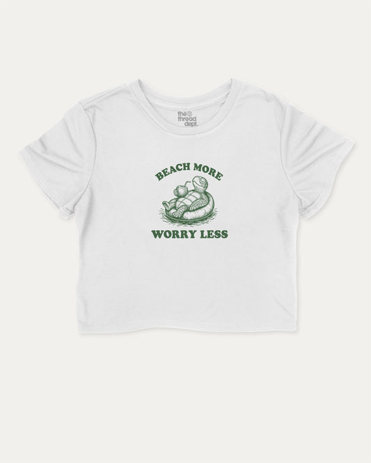 Beach More Worry Less cute and trendy crop tee with nostalgic graphic, perfect for women. A must-have cropped summer shirt, ideal for daily outfits and casual days. White crop tee