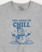 Gray t-shirt with blue snowman graphic and text 'You Need to Chill' on a white background